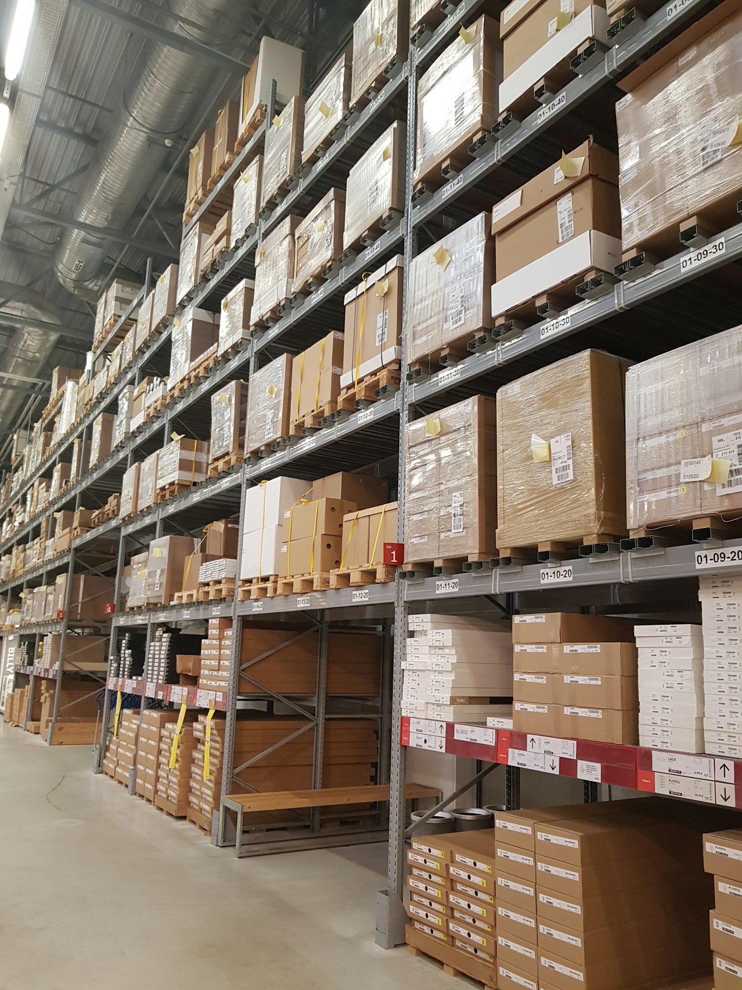 Racks with boxes in a hypermarket warehouse